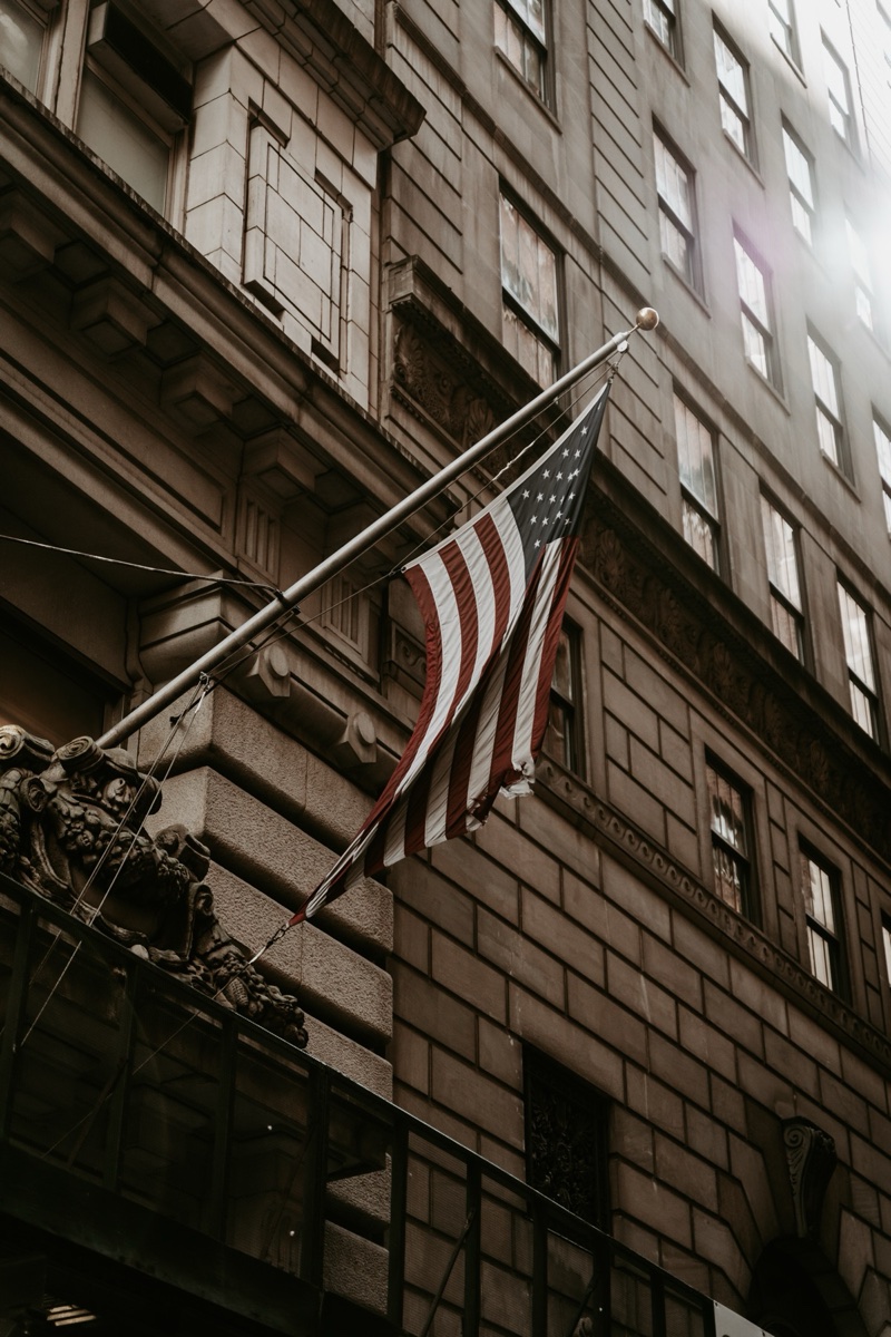 American flag on a stone facade