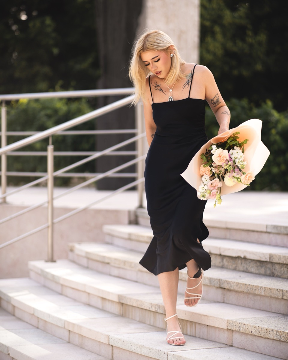 Walking portrait on stone steps with flowers