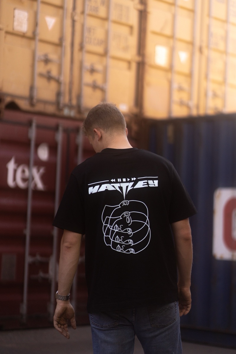 MATTLEY apparel — model with tee among containers