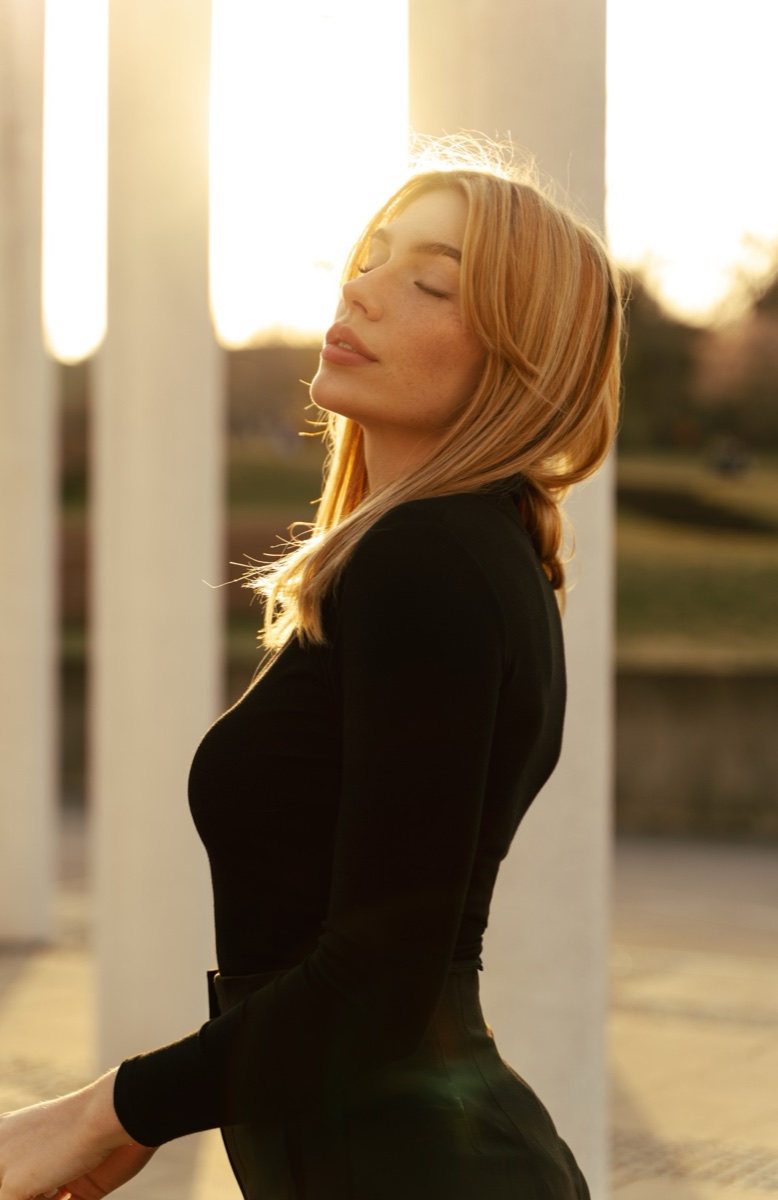 Golden-hour portrait against white columns
