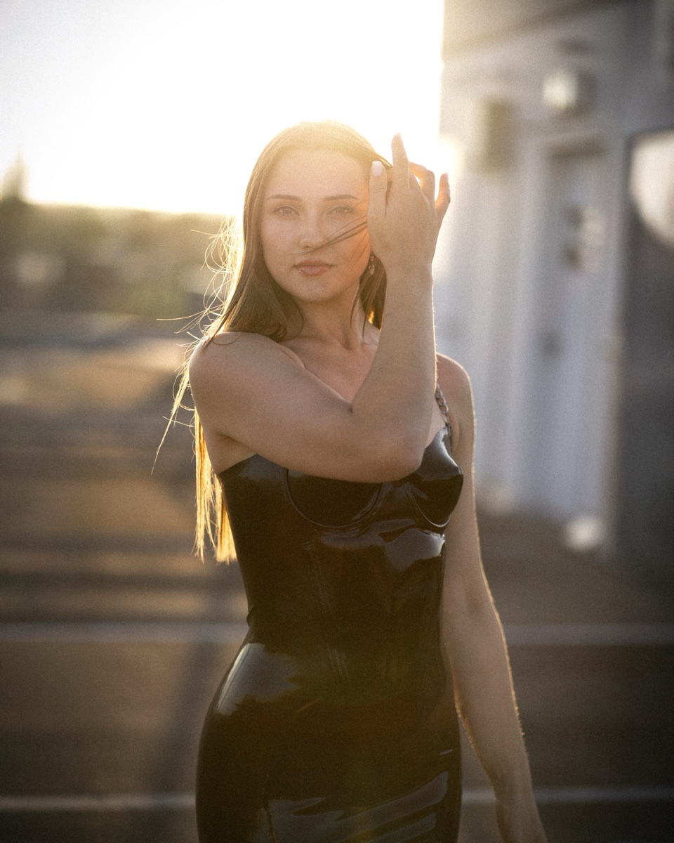 Portrait in a black dress at sunset